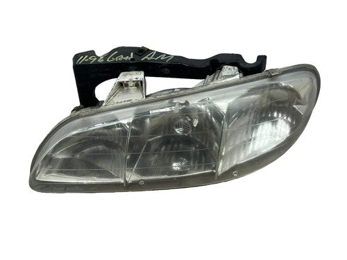 Pontiac Grand AM : 1996, 1997, 1998, Left Driver Headlight With Bracket OEM - actual used OEM auto part, photo 1