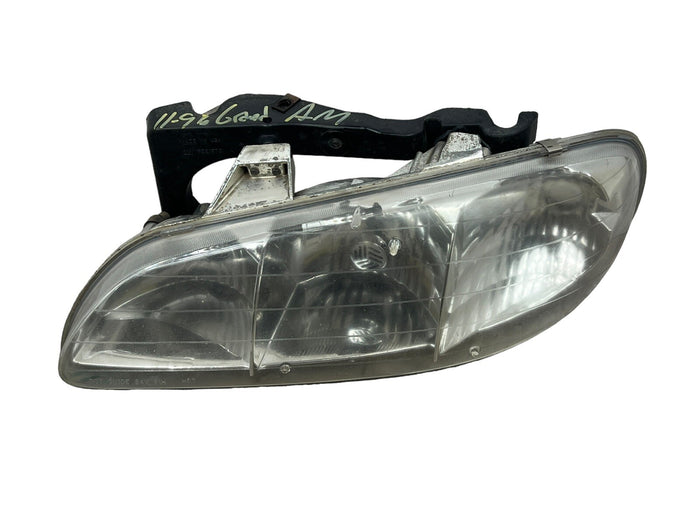 Pontiac Grand AM : 1996, 1997, 1998, Left Driver Headlight With Bracket OEM - actual used OEM auto part, photo 1